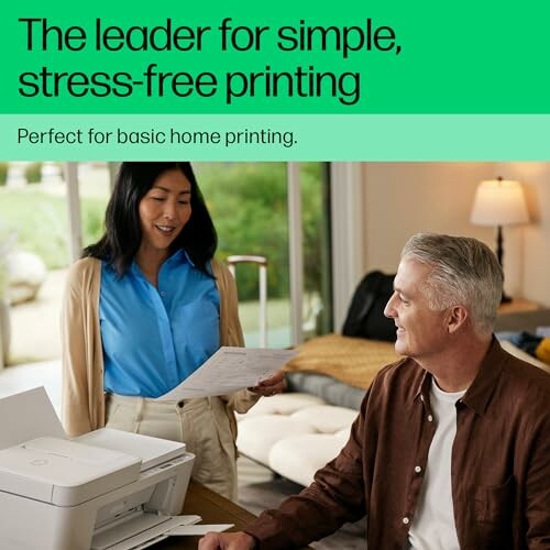 A woman showing a printed paper to a seated man next to a home printer.